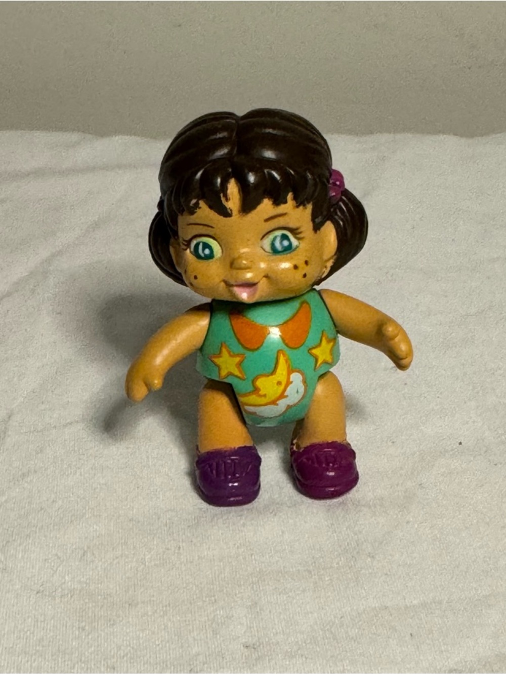 Vintage 1991 figurine is a small baby doll manufactured by New Ray Novelty